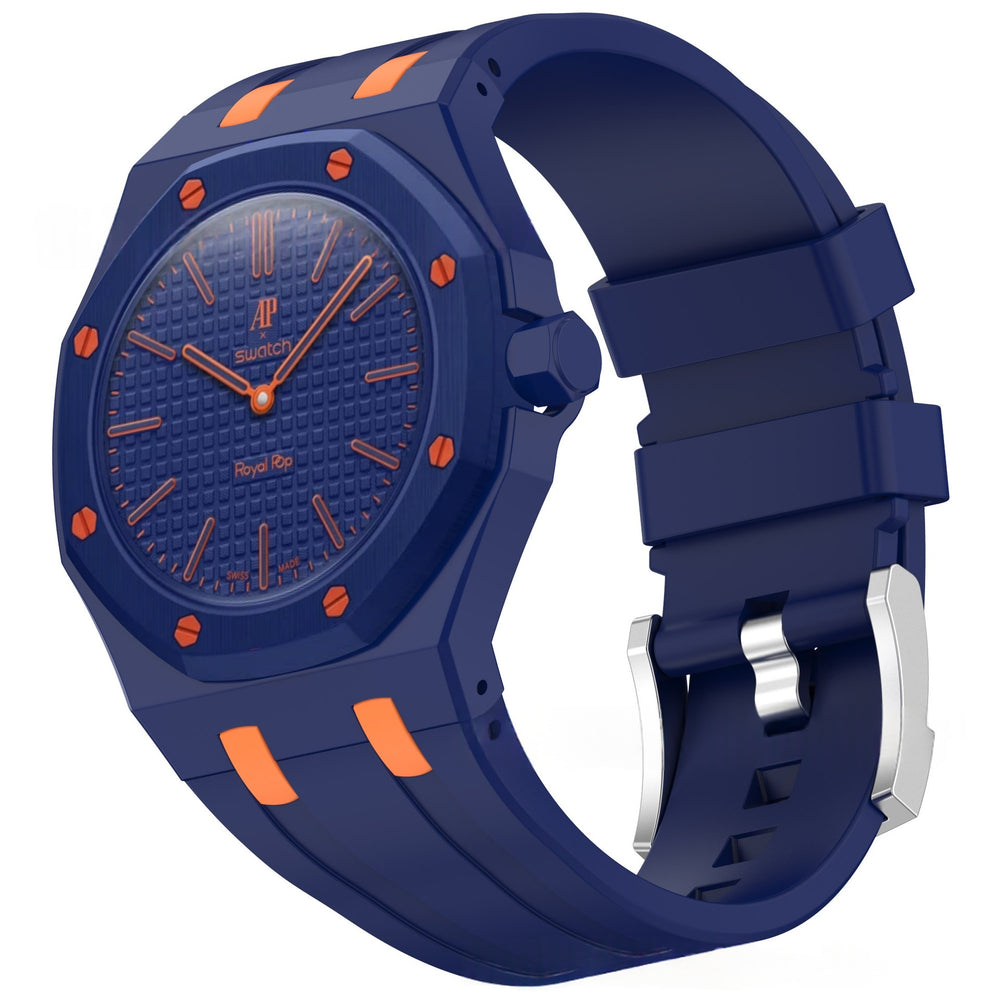 A luxury watch with a dark blue octagonal bezel, textured blue dial, and a matching blue silicone strap accented with orange details and a silver buckle.
