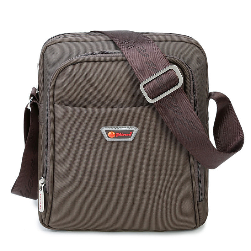 Brown shoulder bag with a visible brand logo on a white background
