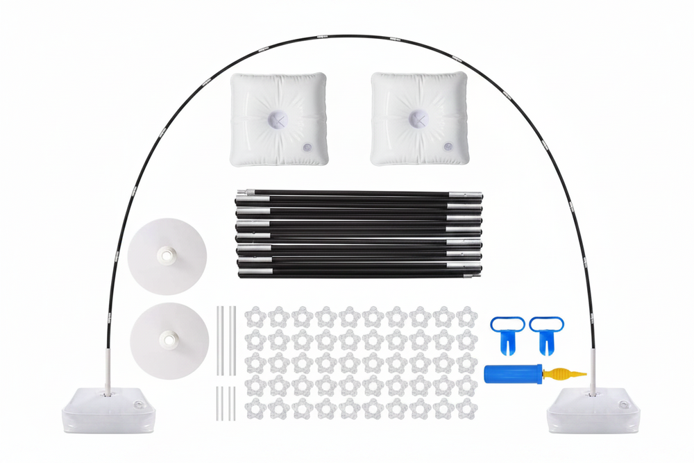 A complete patio umbrella kit laid out on a white background, including a black pole frame, two white fabric canopy panels, two white base covers, two white round discs, several black pole sections, white mounting hardware, and blue/yellow accessories.