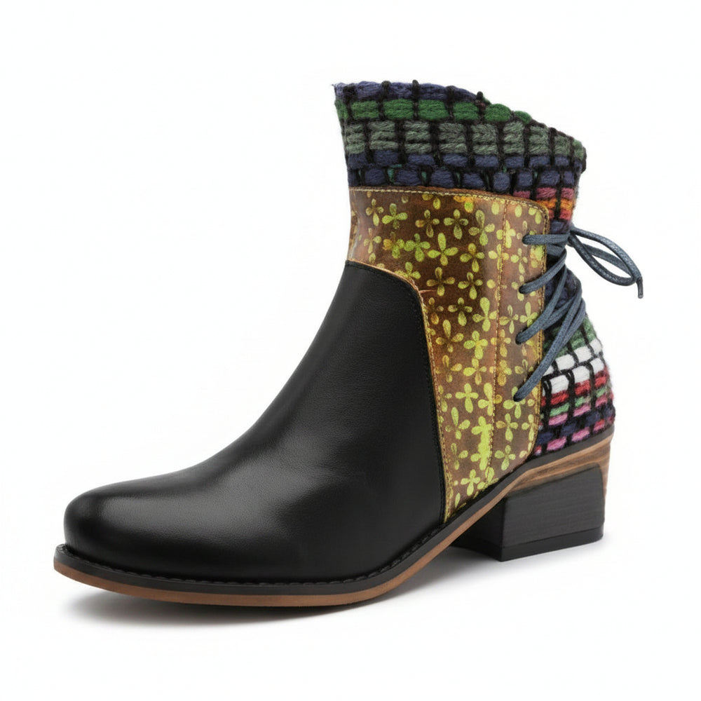 Black ankle boot with colorful patterned top on a white background