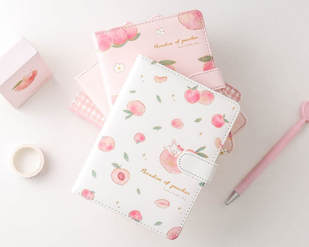 Set of stationery items with floral design on a white background