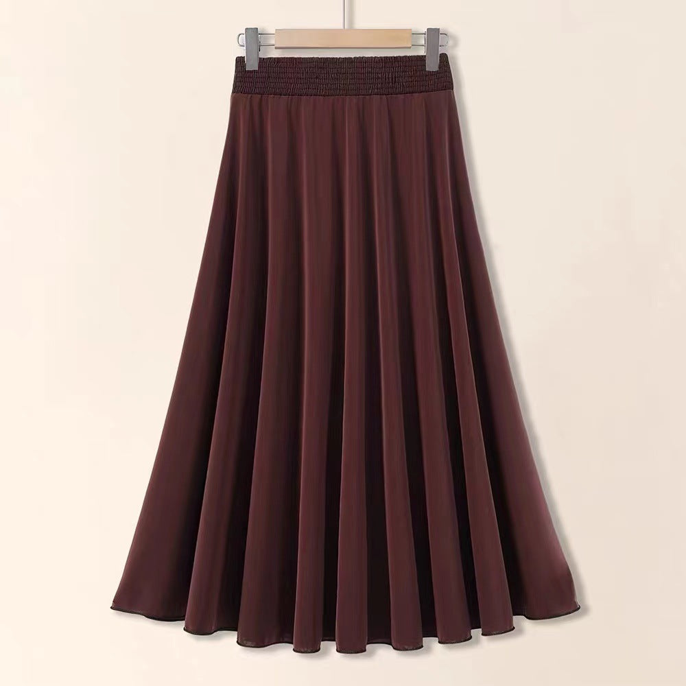 Brown skirt on a hanger against a beige background