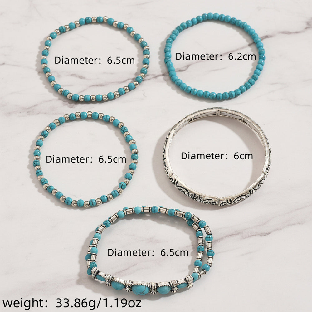 Five beaded bracelets displayed on a wooden surface, with text labels showing diameters ranging from 6.2 cm to 6.