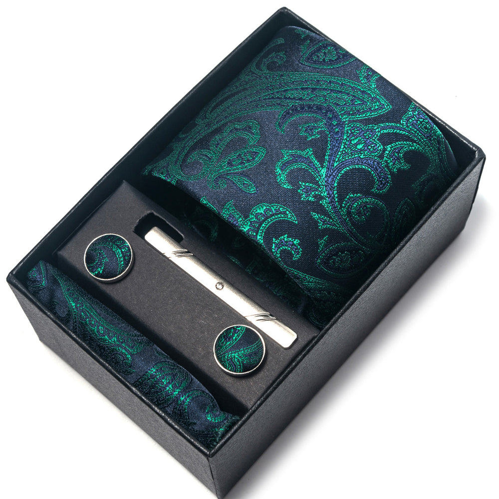 Green paisley tie set with tie clip and cufflinks in a black box on a white background