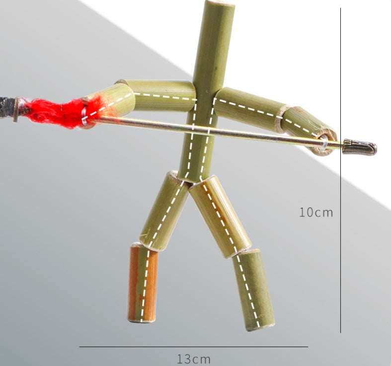 Model of a person made from bamboo sticks with measurements on a gray background