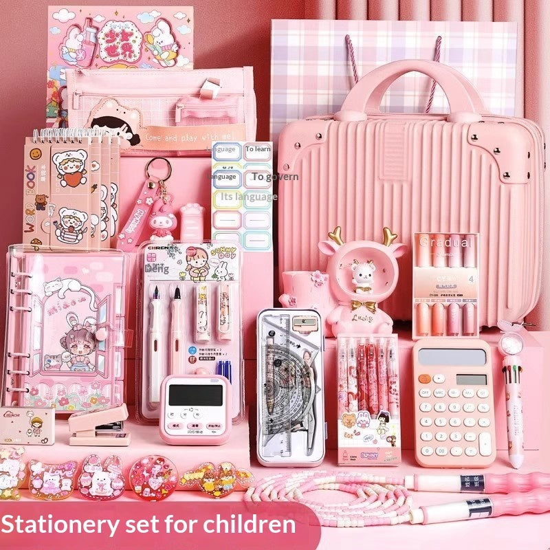 Pink stationery set for children with various items on a pink background