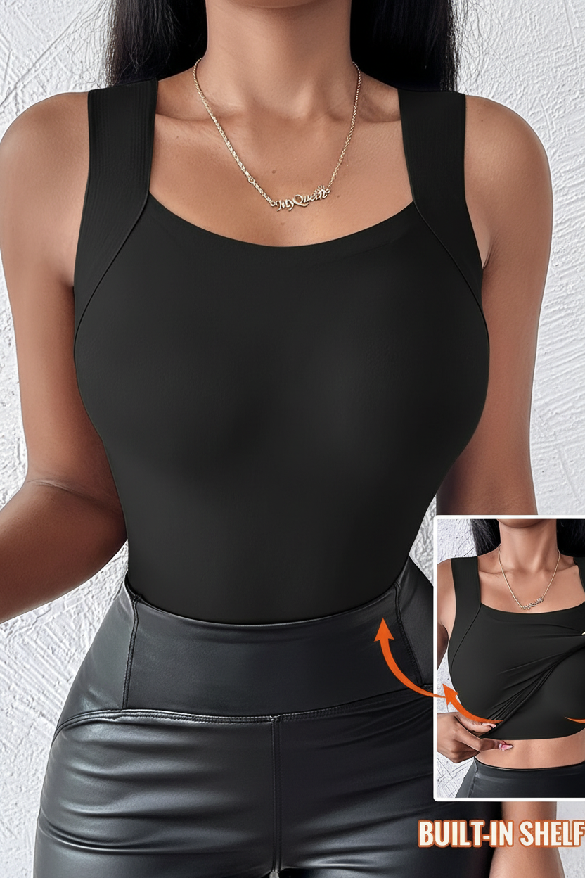 A woman wearing a black sleeveless scoop-neck bodysuit with built-in shoulder panels, paired with black faux-leather pants. The image includes a small inset showing the underbust area and an orange arrow indicating the shaping effect.