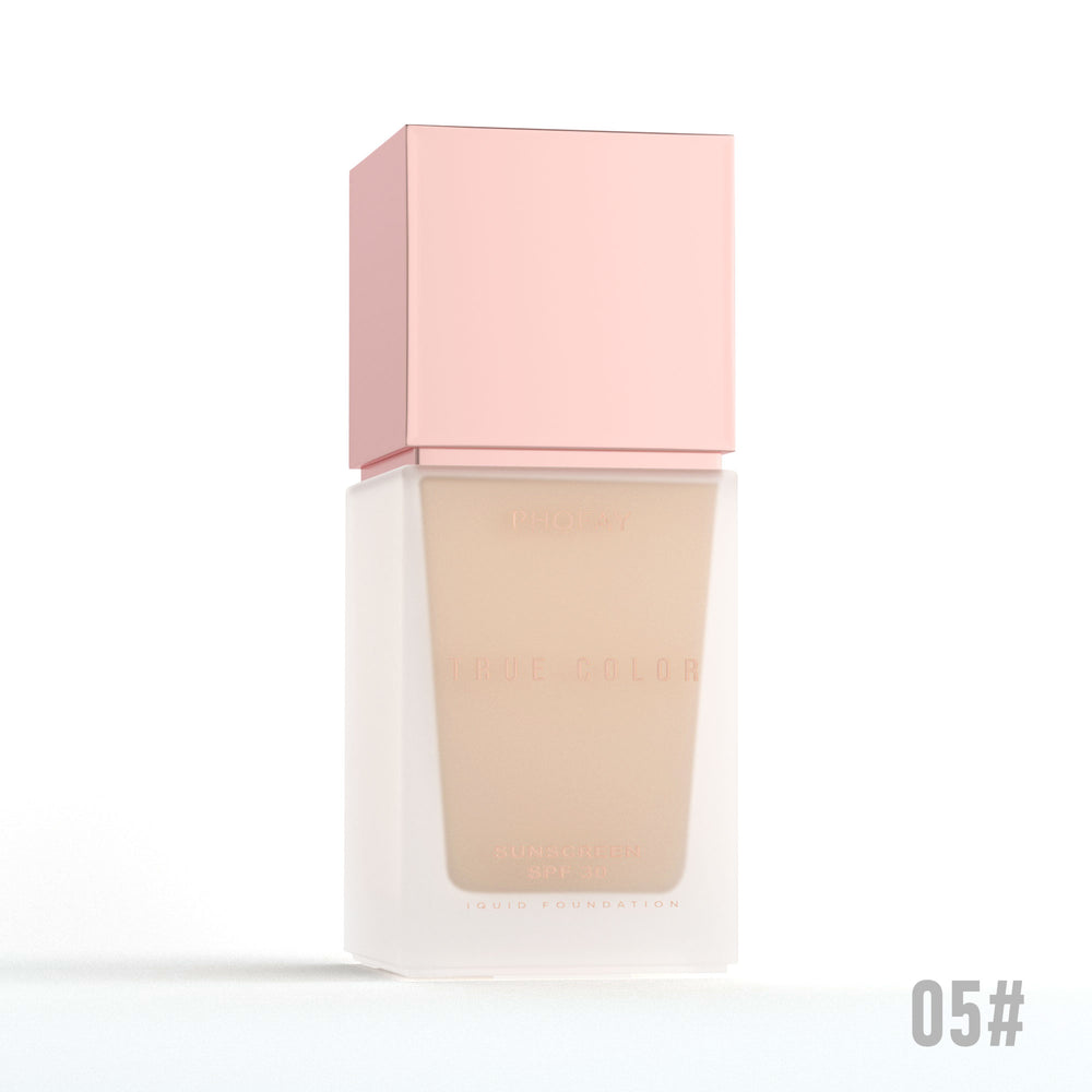 Foundation bottle with pink cap on a white background