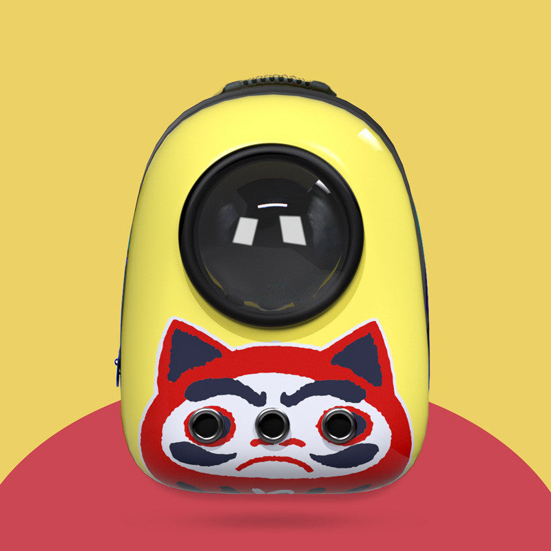 Yellow pet carrier with a red and black cat face design on a yellow background