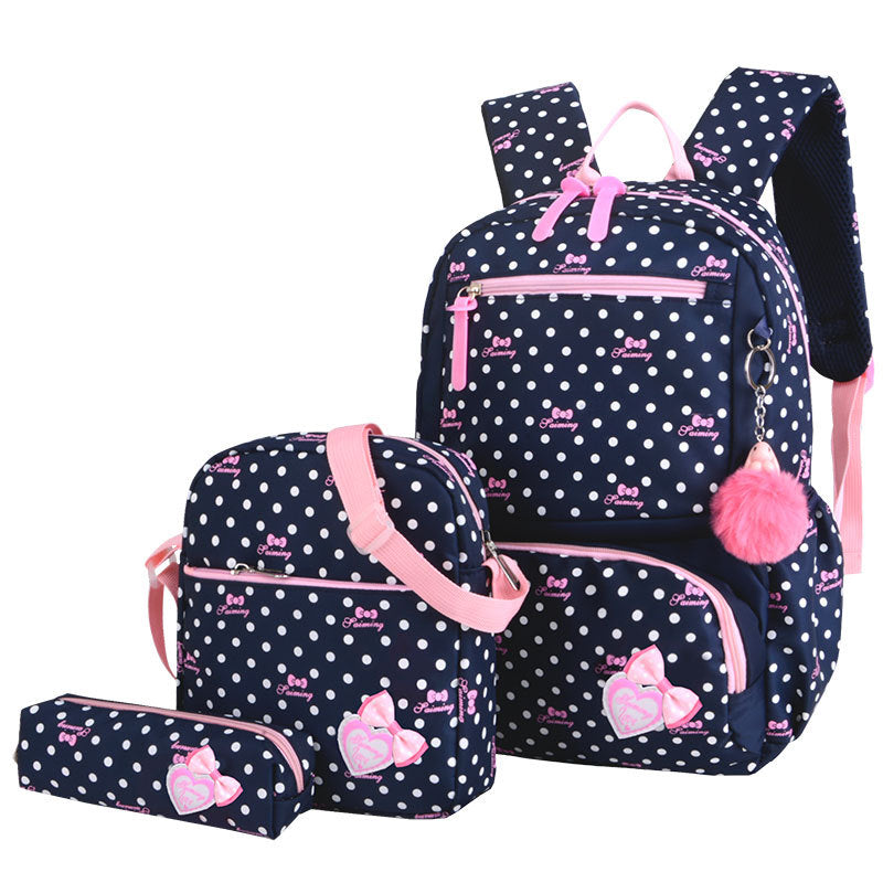 Polka dot backpack set with pink accents on a white background