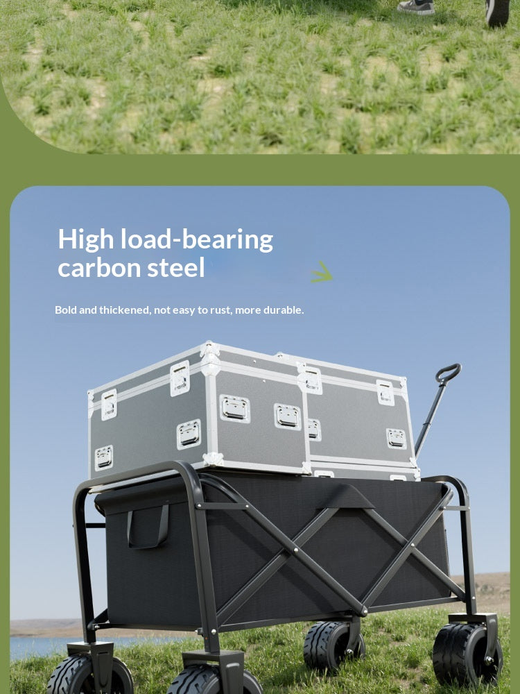 A black and gray wheeled cargo wagon outdoors on grass, with a gray hard-sided case stacked on top. Text on the image reads 'High load-bearing carbon steel' and 'Bold and thickened, not easy to rust, more durable.