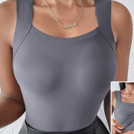 Gray athletic top worn by a person with a close-up inset showing the waist area.