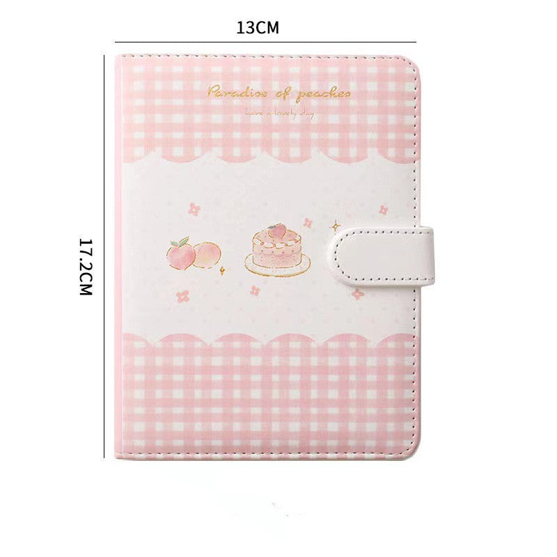 Pink checkered notebook with cartoon designs and measurements on a white background