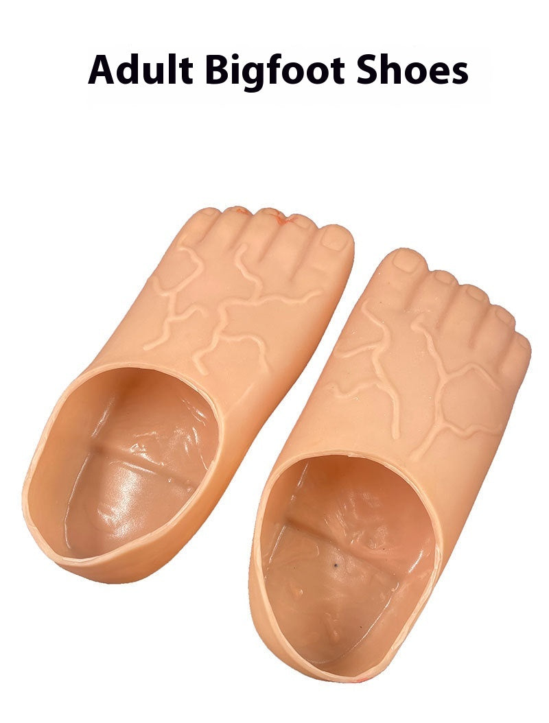 A pair of novelty adult Bigfoot shoes designed to look like feet, shown on a plain white background with the text 'Adult Bigfoot Shoes' at the top.