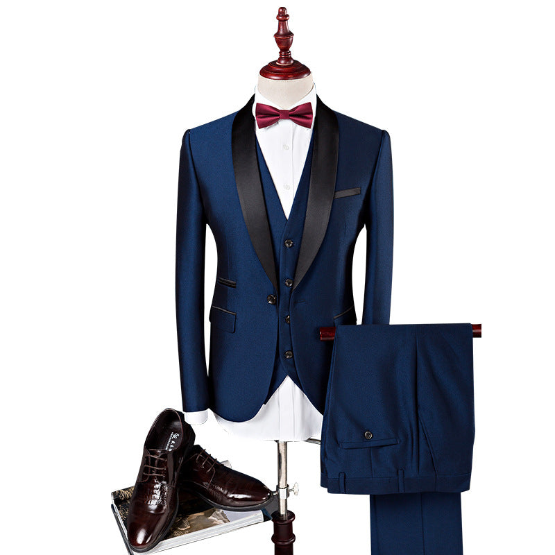 Blue tuxedo with black lapels, bow tie, and brown shoes on a white background
