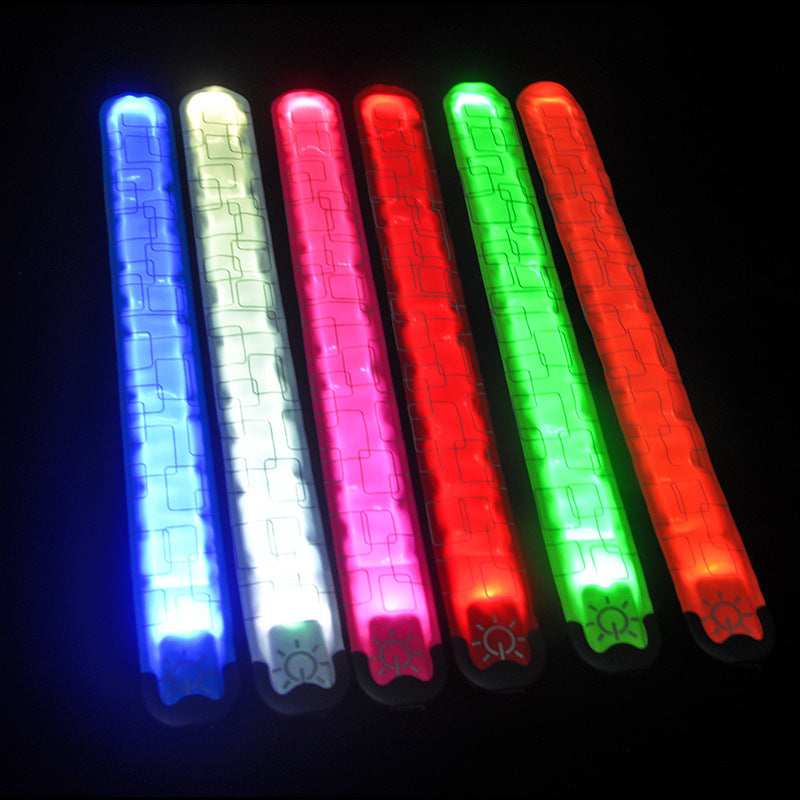 Set of six LED light sticks in blue, green, red, and pink on a black background