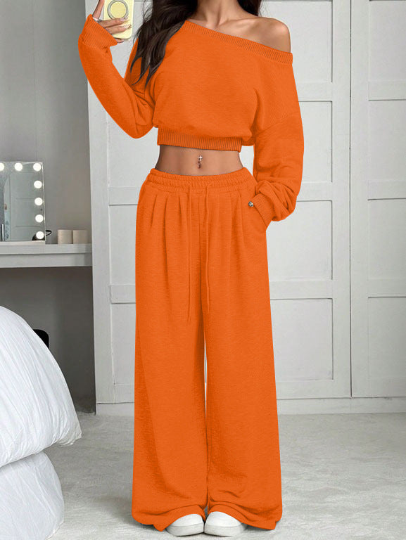 Person wearing an orange outfit in a bedroom setting