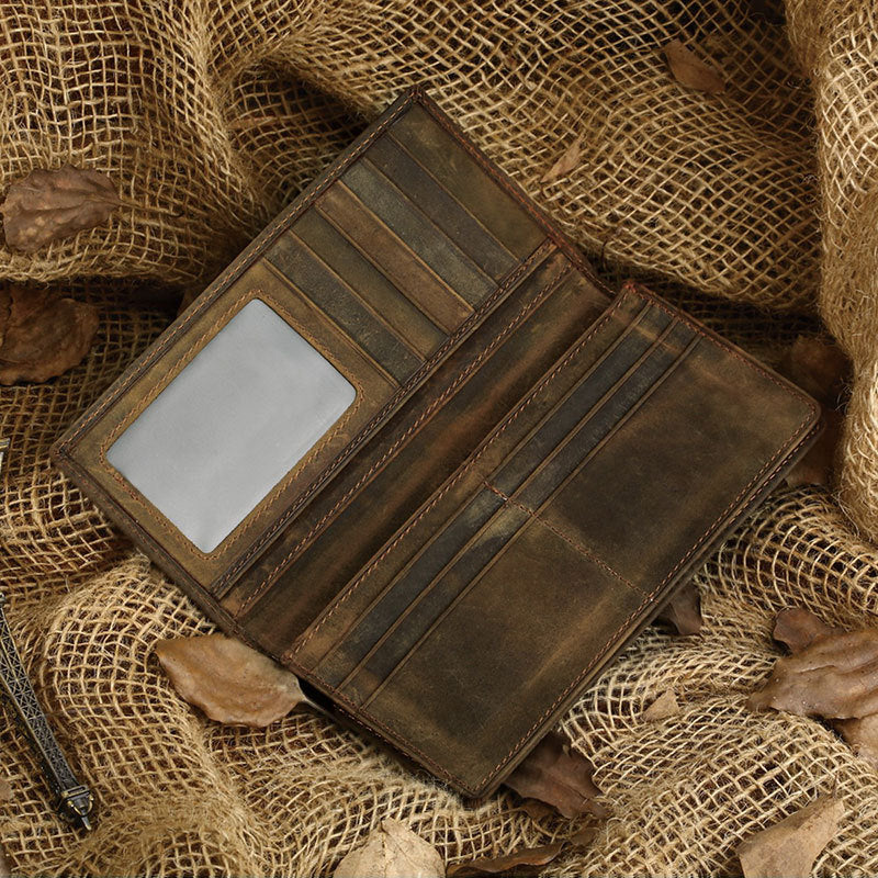 Brown leather wallet on a rustic fabric background