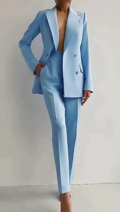 Light blue suit worn by a person on a plain background