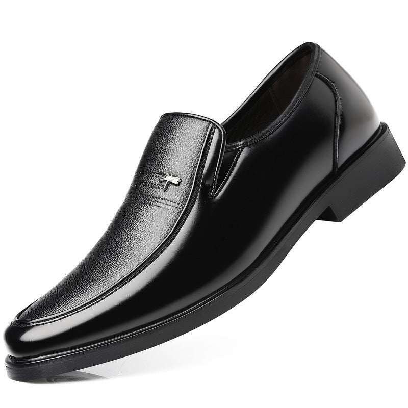 Black leather dress shoe on a white background