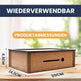 Wooden box with dimensions labeled on a blurred natural background