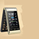Flip phone with clock display on a beige background