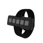 Black Bluetooth car kit with control buttons on a white background