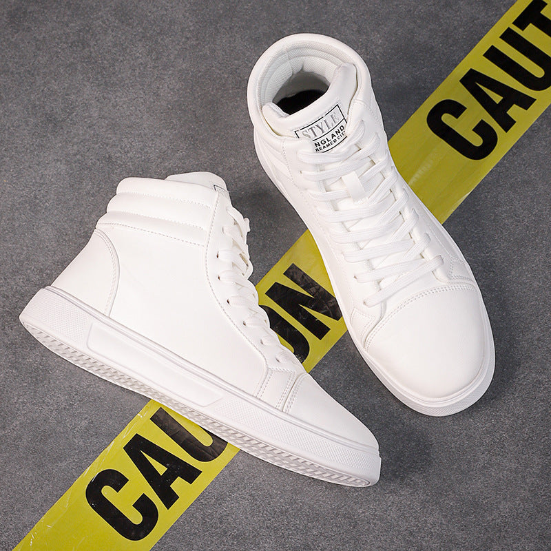 White high-top sneakers on a gray surface with yellow 'Caution' tape.