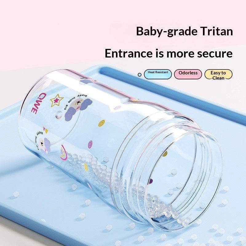 Clear tumbler with cartoon designs on a light blue background, featuring text about baby-grade Tritan material.