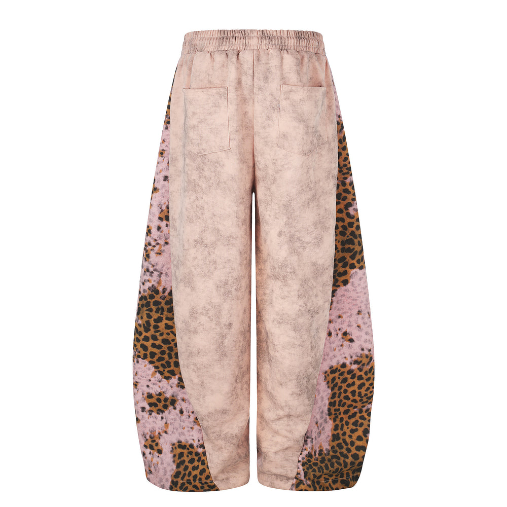 Light pink pants with leopard print accents on a white background