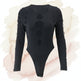 Black bodysuit with cut-out design on a white background