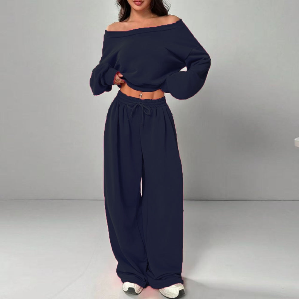 Navy blue off-shoulder top and wide-leg pants set on a gray background