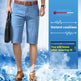 A man wearing light blue denim knee-length shorts, a brown belt, and brown leather shoes, standing in a water-splashed promotional scene with a blue panel that reads 'Instant coolness' and includes a thermometer graphic.