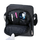 Black travel bag with compartments containing a phone, sunglasses, and other items on a white background