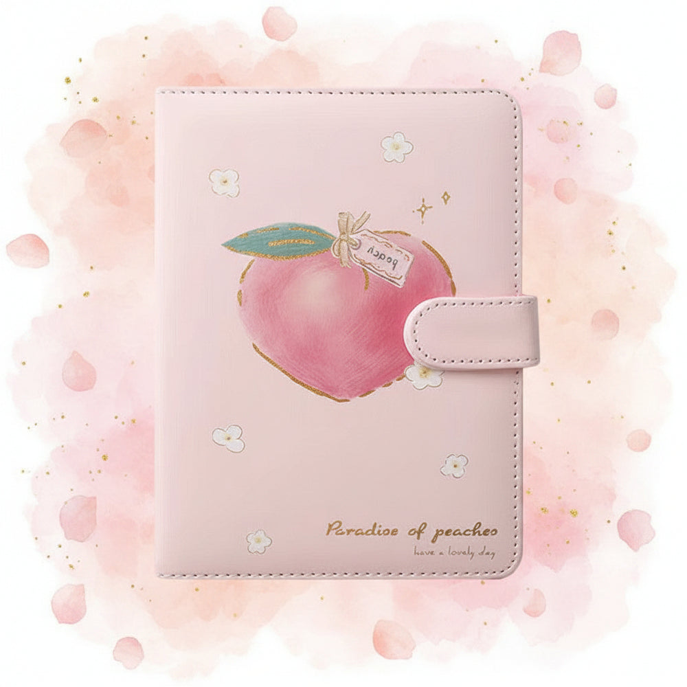 Pink notebook with peach design and measurements on a white background