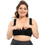 Woman wearing a black zip-up sports bra on a white background