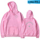 Pink hoodie with 'Swimming' text on front and back, on a white background.