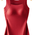 Red tank top on a wooden hanger against a white background