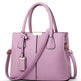 Purple handbag with a strap on a white background