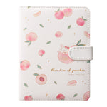 Notebook with peach pattern and decorative elements on a white background