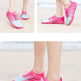 Three-panel collage showing a person wearing bright pink and light blue water shoes on a sandy beach. The top-left panel includes the text 'Swimming, traveling, hiking' and 'Swimming Travel Hiking'; the bottom panel has small text blocks at the bottom.