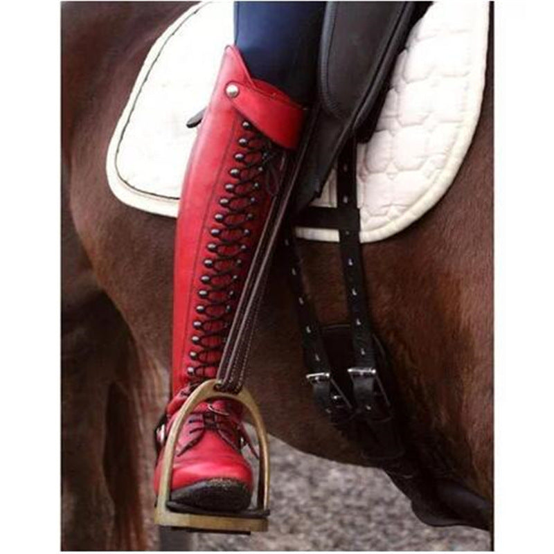 Red equestrian boot with stirrup on a horse