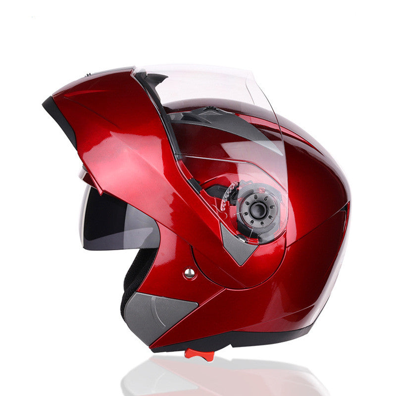 Red motorcycle helmet with a clear visor on a white background