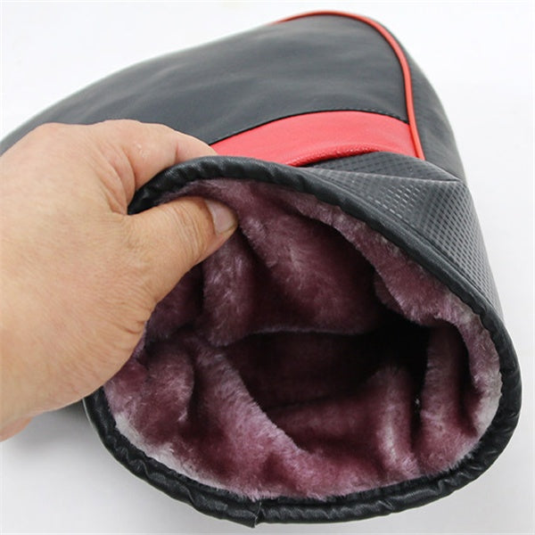 Hand holding a gray and red bag with purple interior lining on a white background