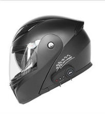 Black motorcycle helmet with clear visor on a white background