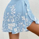 Light blue skirt with white floral pattern on a plain background