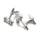 Silver gavel cufflinks on a white background