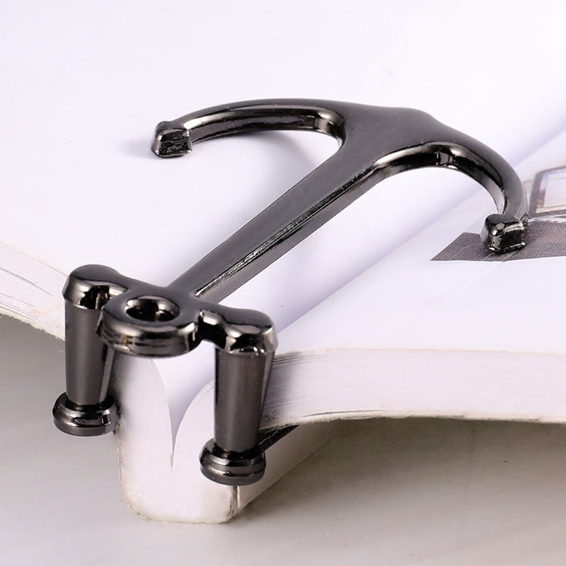 Metallic clip on a magazine with a white background