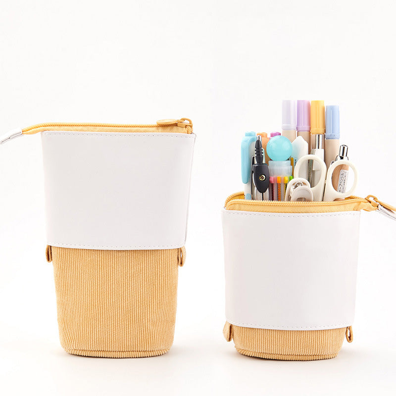 Two pencil cases, one white with a yellow base and the other filled with stationery on a white background.