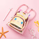 Pink heart-shaped bag with cartoon character on a pink background